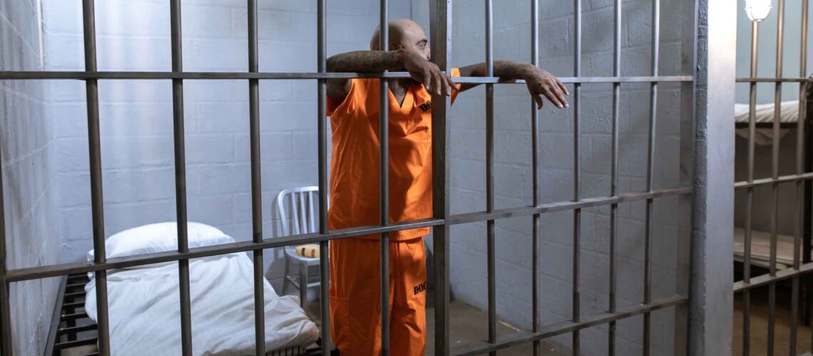 man in jail cell